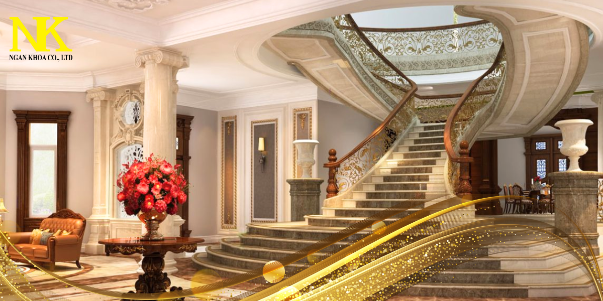 Sảnh vào biệt thự tân cổ điển hoành tráng với cầu thang uốn lượn, sàn đá hoa cương đánh bóng, đèn chùm lớn và các chi tiết tường trang trí tỉ mỉ